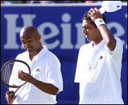 Paes and Bhupathi in their first round match - AFP