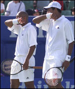 Paes and Bhupathi after their defeat - AFP