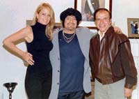 legend Diego Maradona (C), wearing a turban, visits former president Carlos Menem