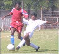 Maharashtra's goal scorer S Venkatesh (left) tries to get past Railways' Asif Jamal.