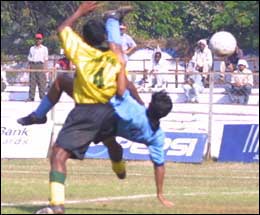 Kerala's Asif Saheer executes a reverse kick to score.
