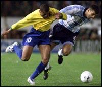 Argentina's Walter Samuel (R) battles Brazil's Rivaldo 