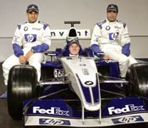 Drivers Colombian Juan Pablo Montoya (L), German Ralf Schumacher (C) and Spanish Marc Gene pose for photographers during the new BMW Williams FW25 car launch. 