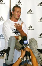 Beckham talks with reporters in Japan