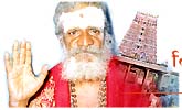 Dr Dr Viswanatha Sivacharyar in the backdrop of the Kapaleeswara temple